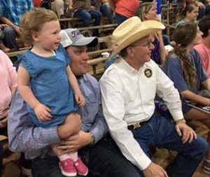Sheriff and a Family at a Rodeo